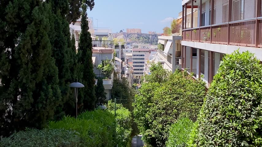 View across the rooftops of the Kolonaki district of central Athens to the Parthenon temples on the Acropolis, Greece	