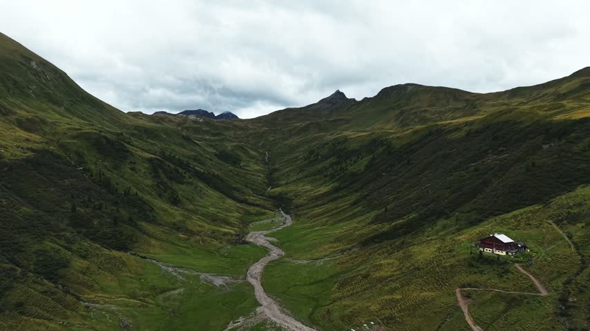 Beautiful mountain range with alpine hut