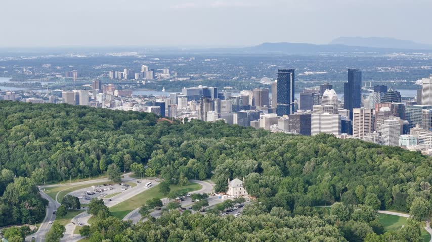 Montreal downtown skyline from Mount Royal with park, lake and greenery in summer, Quebec, Canada. g.