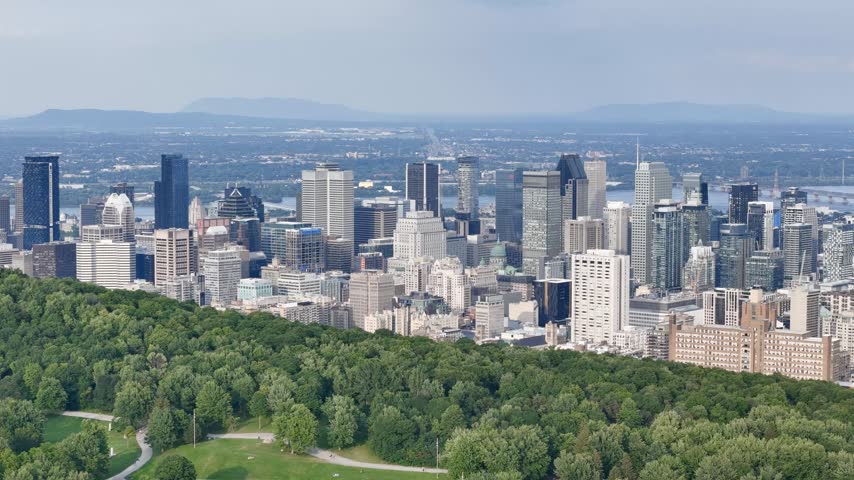Montreal downtown skyline from Mount Royal with park, lake and greenery in summer, Quebec, Canada. g.
