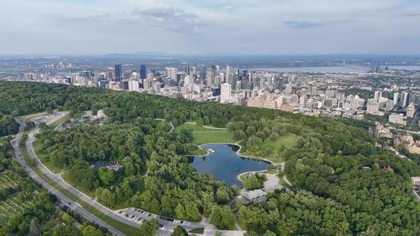 Montreal downtown skyline from Mount Royal with park, lake and greenery in summer, Quebec, Canada. g.