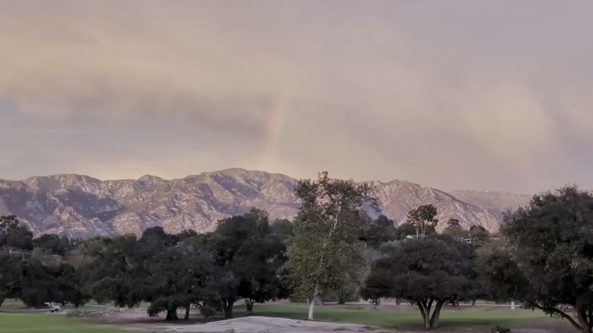 Rainbow over the San Gabriel mountains at sunset