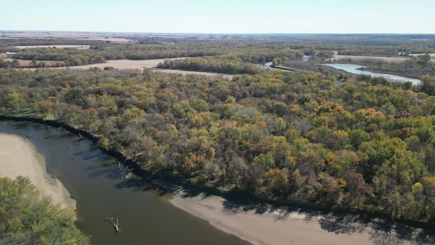 Forests, rivers and fields of Iowa in the fall. Flying in a drone above the serene landscape. 4k, flying forward, drone