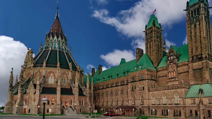 Canadian Parliament in Ottawa in a sunny day, CanadaOttawa skyline with Parliament Hill and Ottawa River at sunset - Ottawa, Ontario, CanadaView of the Parliament of Canada buildings from behind