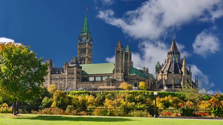 Canadian Parliament in Ottawa in a sunny day, CanadaOttawa skyline with Parliament Hill and Ottawa River at sunset - Ottawa, Ontario, CanadaView of the Parliament of Canada buildings from behind