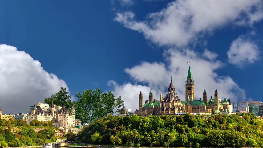 Canadian Parliament in Ottawa in a sunny day, CanadaOttawa skyline with Parliament Hill and Ottawa River at sunset - Ottawa, Ontario, CanadaView of the Parliament of Canada buildings from behind