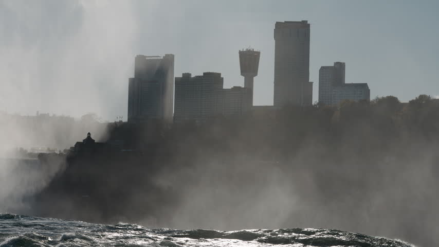 Misty View of Niagara Falls Canada and Skylon Tower from American side of Niagara Falls
