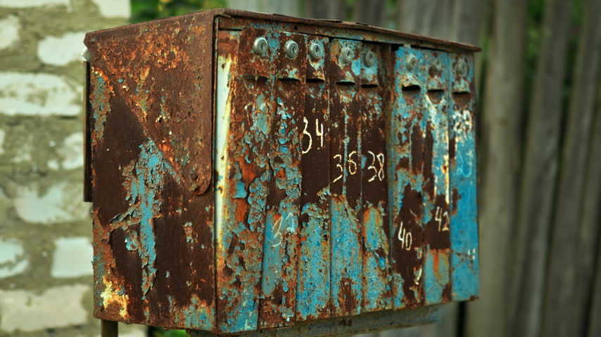 Vintage Mailboxes against long grass background in the village. outdoor mail.