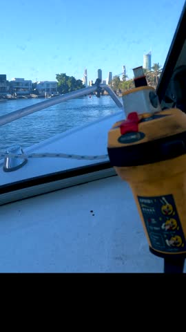 POV shot from a motorboat bow cruising along sunny river waterways in Gold Coast, Australia.