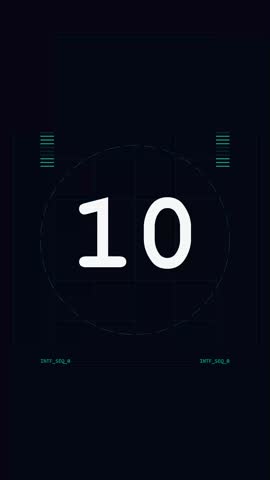A monochromatic digital countdown sequence appears on a dark background featuring technical grid lines. Large white numbers cycle downward in an minimalist style. Faint interface markings and oval frame overlays provide a broadcast aesthetic. This visual element conveys urgency and preparation for professional cinematic production or television start sequences.