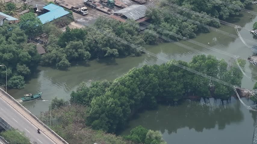 Small Boat Moving Along River