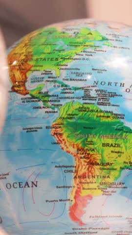 Globe closeup displays North and South America with many Caribbean nations