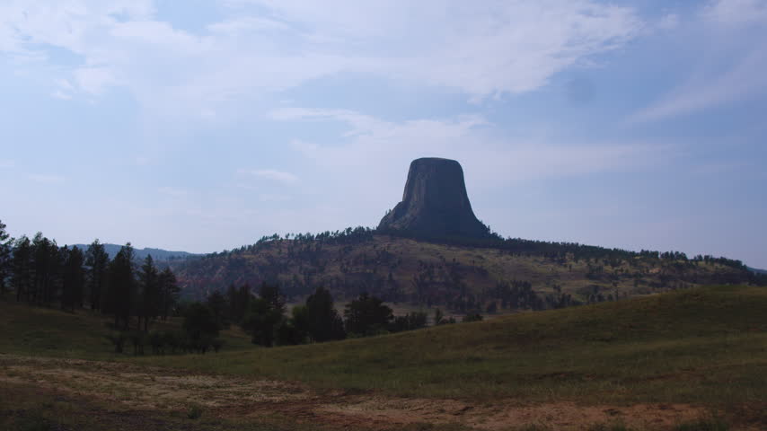 A Scenic Timelapse View Of Devils Tower In Wyoming From Afar.