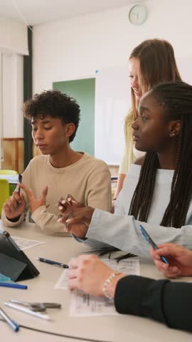 Diverse students collaborating on a group project in a classroom