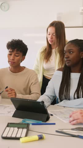 Diverse students collaborating on a group project in a classroom