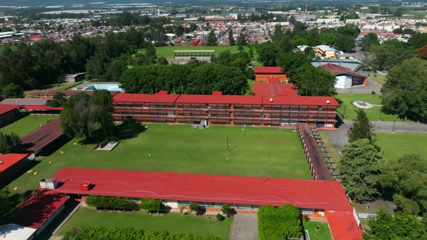 Aerial perspective of the university campus in Ciudad Guzman with mountains in the background