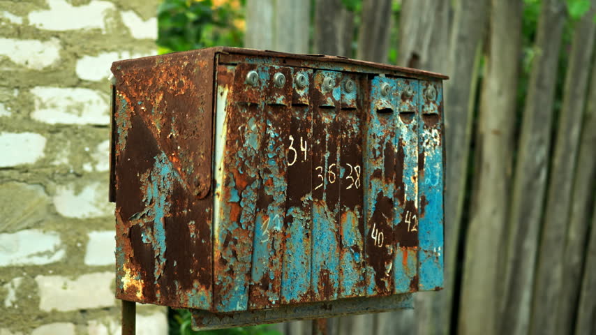 Vintage Mailboxes against long grass background in the village. outdoor mail.