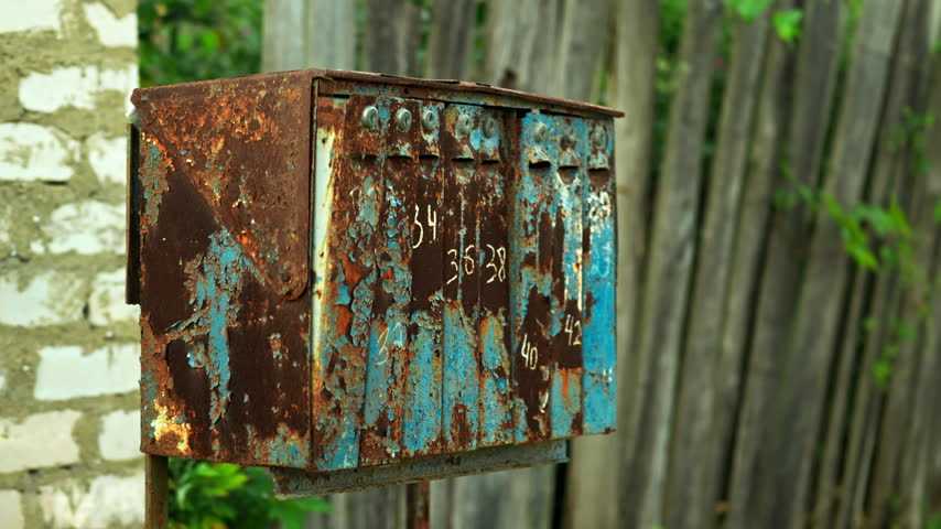 Vintage Mailboxes against long grass background in the village. outdoor mail.