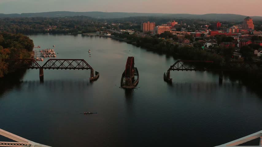 Drone flyover of Portland Bridge in Middletown Connecticut with a kayaker on the Connecticut River