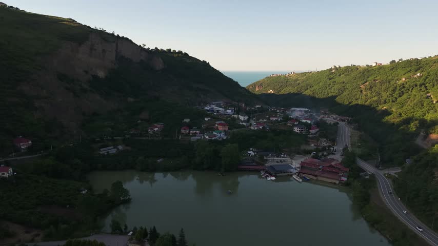 Scenic Freshwater Lake Landscape with Forested Mountains