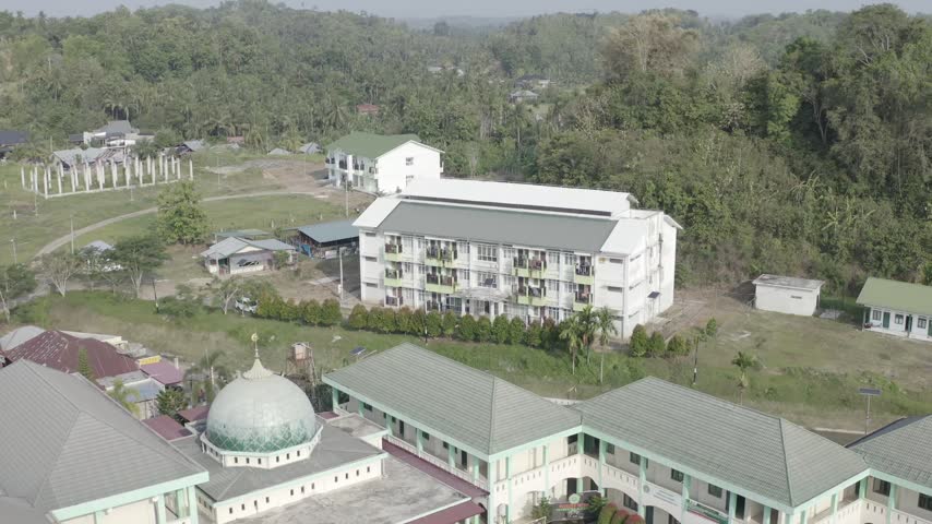 Aerial View of Large Campus Building Complex in a Green Tropical Area