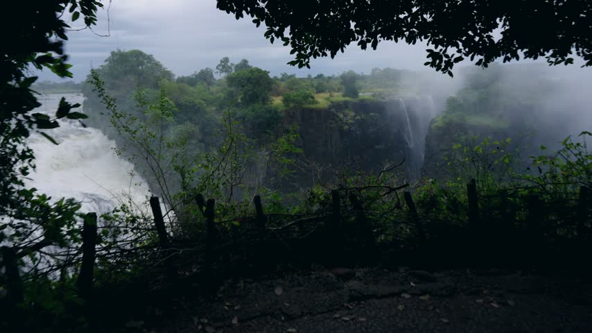 Victoria Falls drops into the gorge with spray rising.