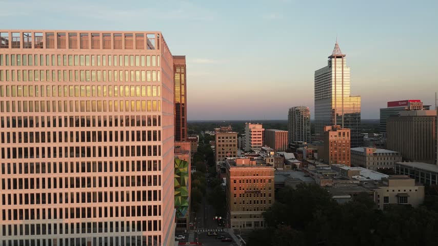 Aerial view of the Raleigh, North Carolina skyline including the new city hall building at sunset