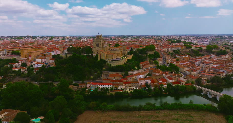 Aerial view of Beziers, charming historic city in southern France, known for the Cathedral of Saint Nazaire, the Canal du Midi, picturesque streets, traditional French architecture