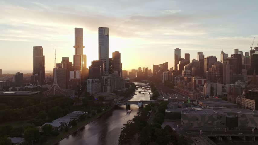 Aerial view of the Melbourne skyline and Yarra River at sunset in Southbank, Victoria, Australia.