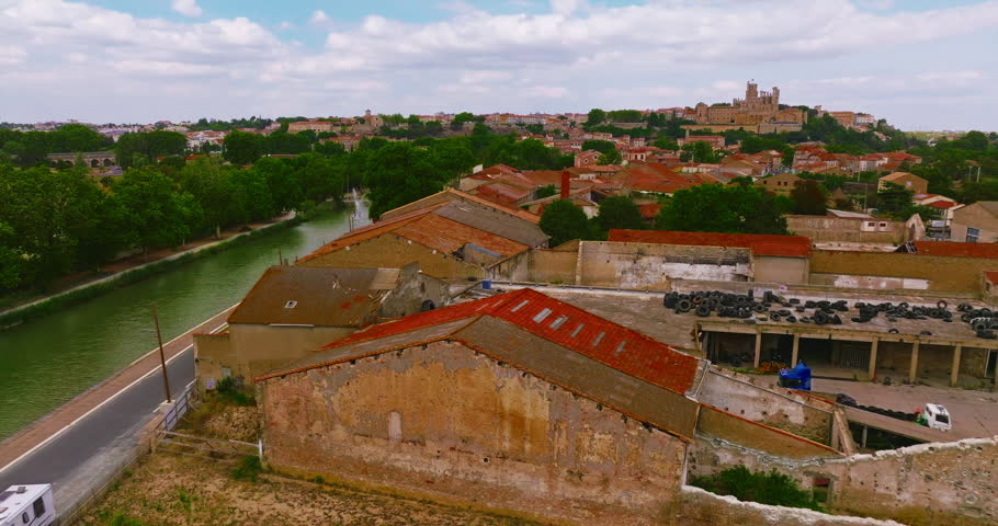 Aerial view of Beziers, charming historic city in southern France, known for the Cathedral of Saint Nazaire, the Canal du Midi, picturesque streets, traditional French architecture