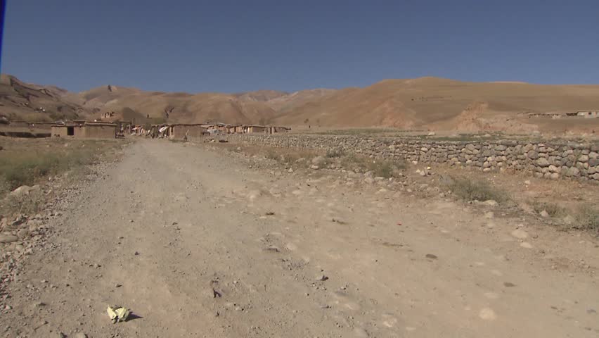Man on motorbike approaching a bazaar in the upper  Yaftal region in the far north east of Afghanistan. Shot in October 2011.