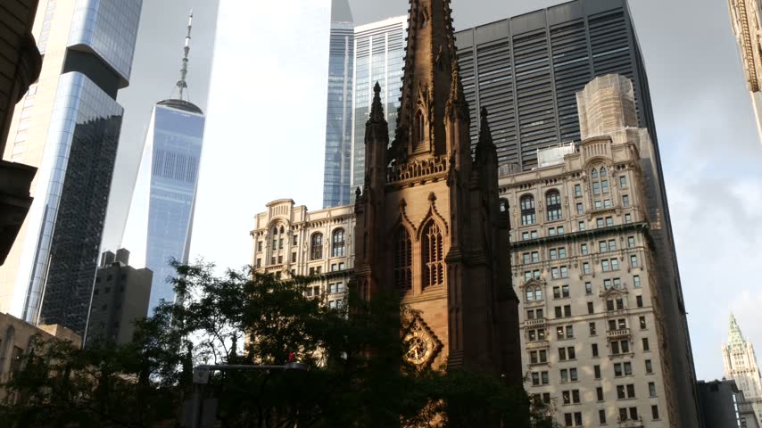 New York City Manhattan Downtown Financial District, United States of America. World Trade Center skyscraper, FiDi tower building. Modern business center, Trinity church 1846 from Broadway. Religion.