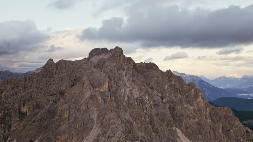 Rugged Jagged Rock Peaks Of Tre Cime di Lavaredo Under An Overcast Sky In The Italian Dolomites. - aerial shot