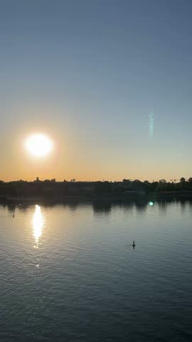 selective focus peaceful Rhine River landscape illuminated by sunrise