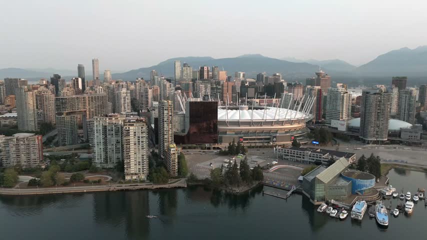 BC Place Stadium In Downtown Vancouver, British Columbia With Distinctive Domed Structure Within The Urban Landscape. Aerial Shot