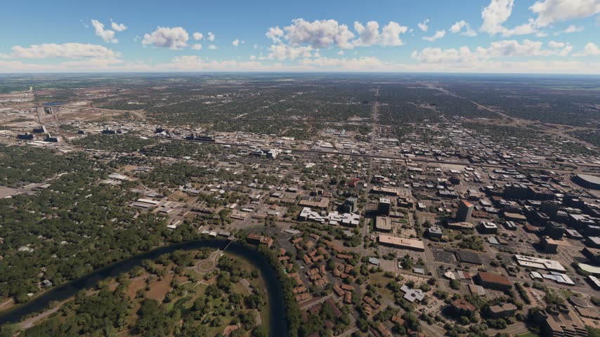 3D - Side aerial drone view of Wichita city and the Arkansas River. Kansas. United States