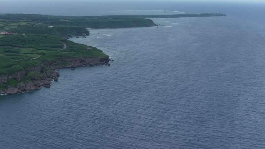 Aerial View Of Rugged Coastal Muiga Cliffs By Deep Blue Ocean On Miyakojima Island, Okinawa, Japan.