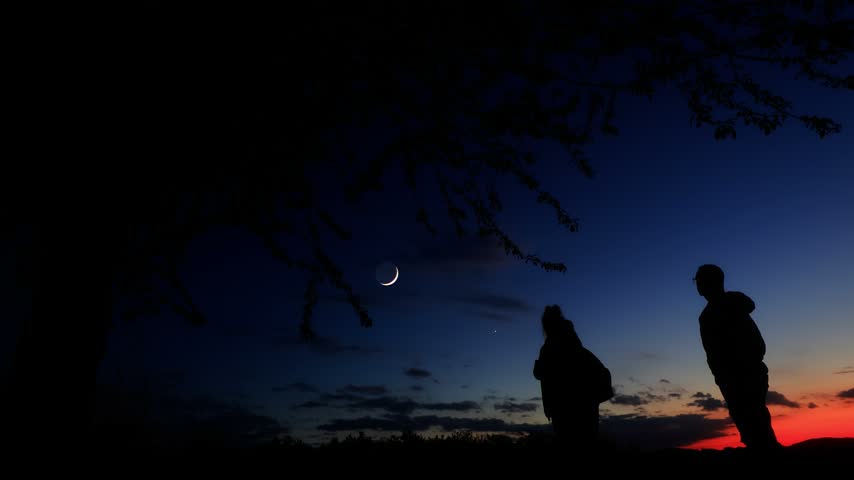 Amateur astronomers enjoying night sky with stars, planets, Moon eclipse and other celestial objects.