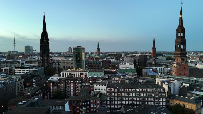 Aerial view of the Hamburg skyline featuring the historic St. Catherine Church, dense urban architecture, and rooftops in Hamburg, Hamburg, Germany.