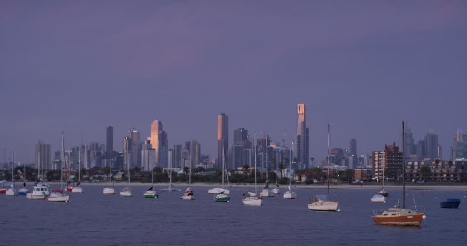 St Kilda yachts and Melbourne skyline at dusk.