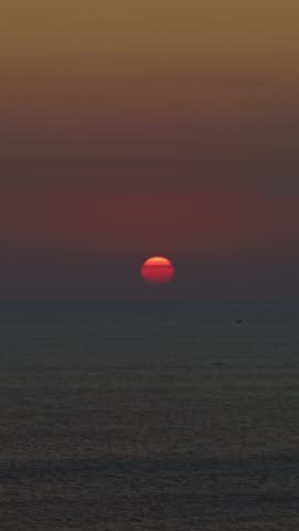 Scenic sun setting over the indonesian sea