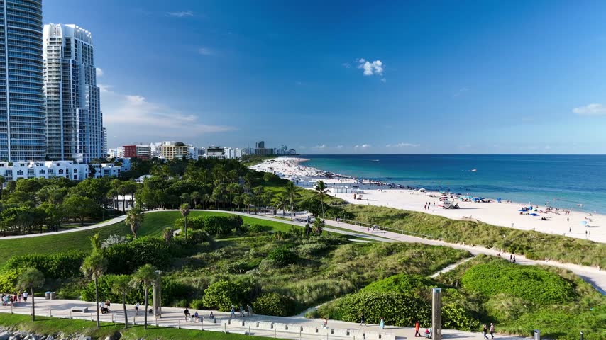 Aerial view of South Beach with white sand, turquoise water, and coastal skyscrapers in Miami-Dade County, Florida, United States.