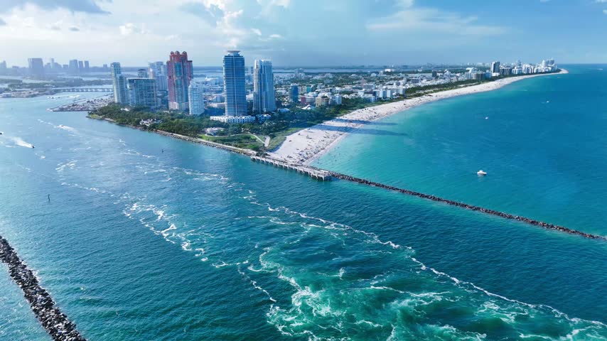 Aerial view of South Beach and the Miami skyline with turquoise ocean waters and sandy coastline in Miami-Dade County, Florida, United States.