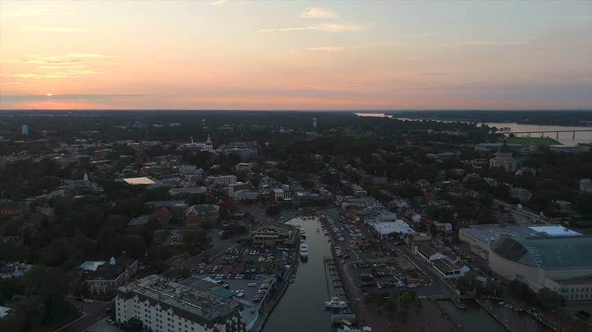 Sunset Horizon Over Annapolis Cityscape, Ego Alley Waterway, And Surrounding Chesapeake Waterways In Maryland, USA. - aerial shot