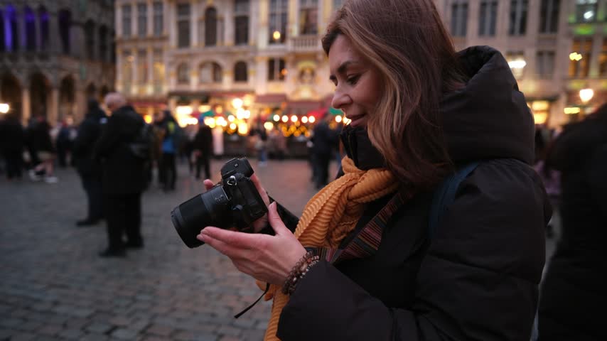 Young Woman Taking Pictures of Main Attractions Of Brussels Belgium At Grand Place In Brussels