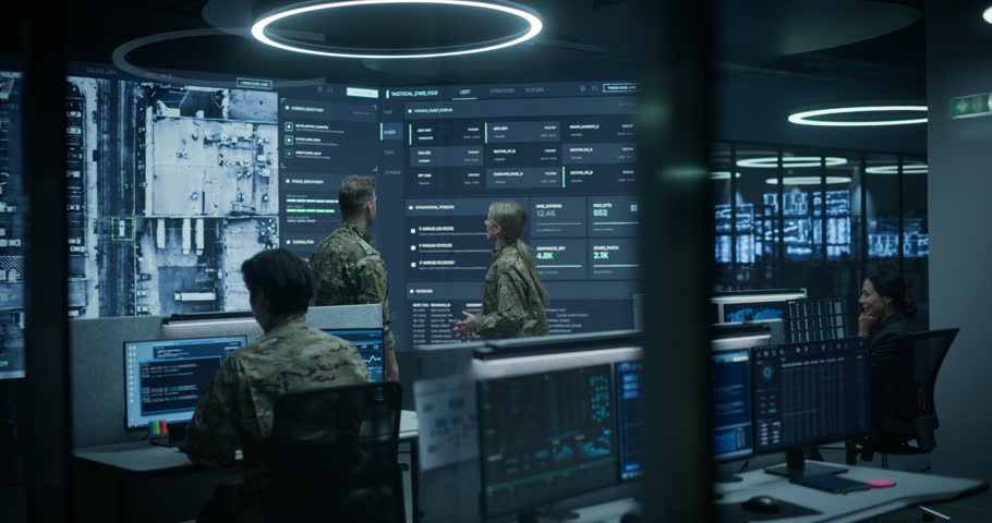 Military Monitoring Control Center With Army Surveillance Screens: Officers, Soldiers and Intelligence Analysts Coordinate a Defense Mission, Reviewing Satellite Maps, Tactical Data, Cybersecurity