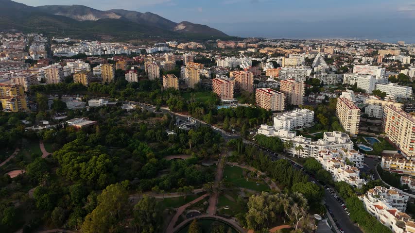 Aerial drone footage of Parque de la Paloma in Benalmadena on the Costa del Sol, Spain, captured on a sunny day. The park
