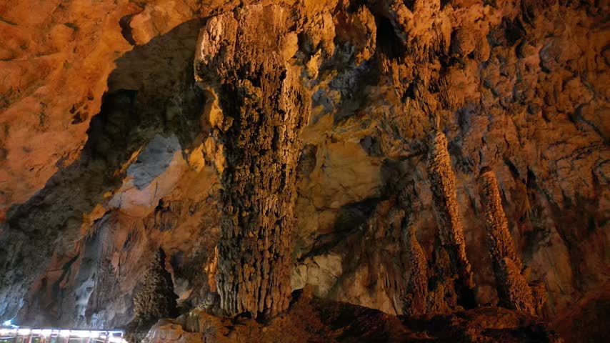 Limestone cave with towering stalagmite columns