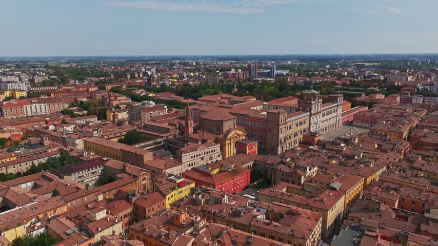 Aerial drone view of Chiesa di San Domenico in Modena, Italy, showcasing the historic church, elegant architecture, surrounding rooftops, streets, and old town cityscape.