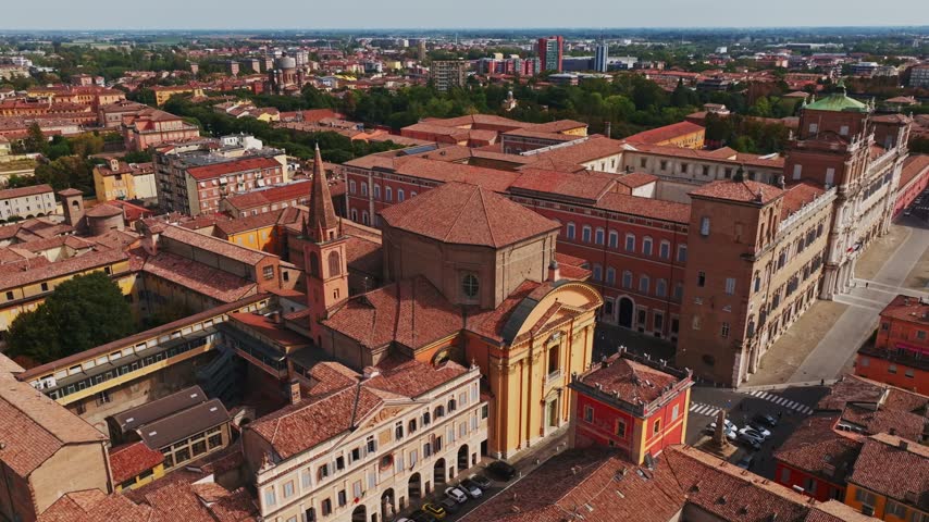 Aerial drone view of Chiesa di San Domenico in Modena, Italy, showcasing the historic church, elegant architecture, surrounding rooftops, streets, and old town cityscape.
